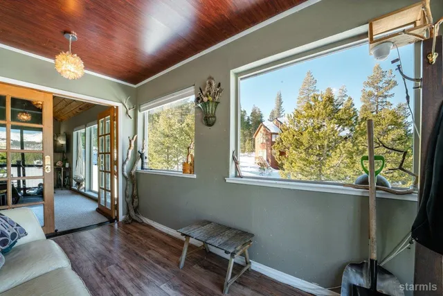 a room with wooden floor and a window