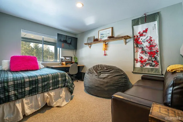 a bedroom with furniture and a bed