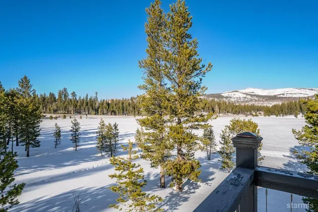 a view of a lake with a building in the background