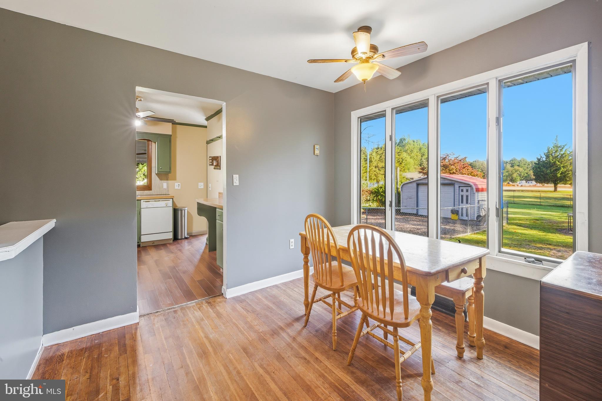 335 Elk Road Monroeville, NJ 08343 - Photo 9 of 19 a view of a dining room with furniture window and wooden floor
