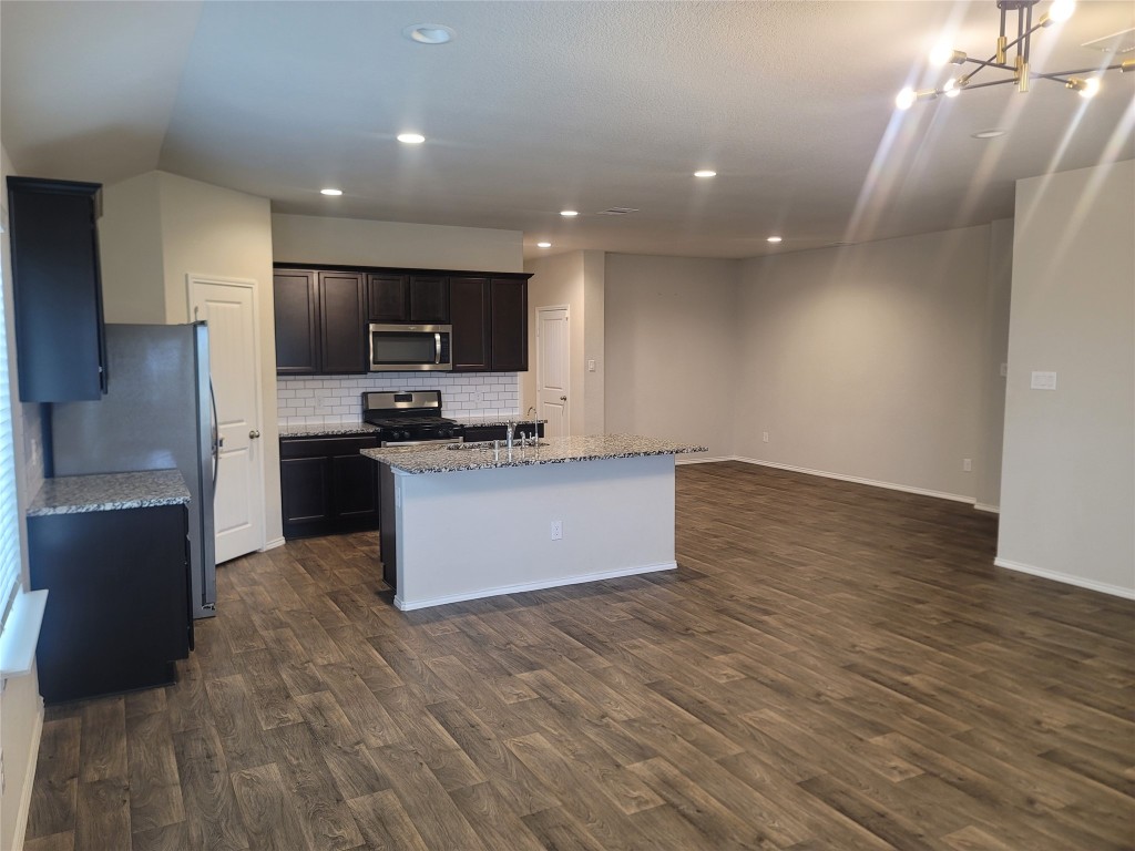 846 Autumn Flats Way Rosharon, TX 77583 - Photo 18 of 26 a kitchen with stainless steel appliances a refrigerator and a stove top oven