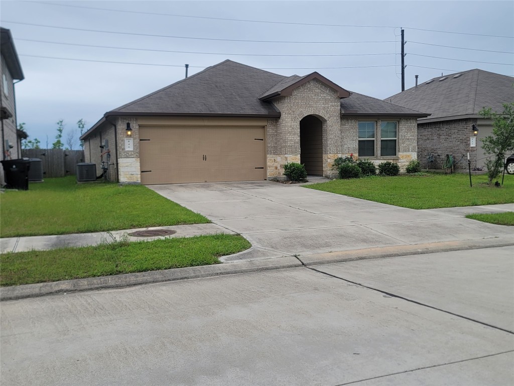846 Autumn Flats Way Rosharon, TX 77583 - Photo 24 of 26 a front view of a house with a yard and garage