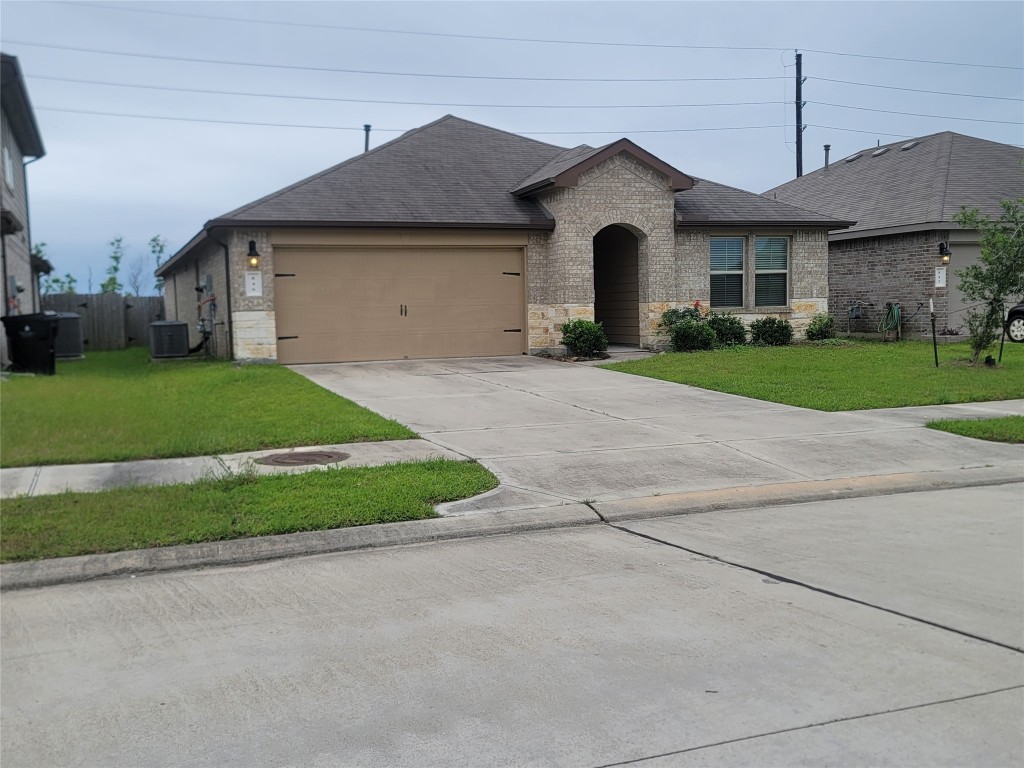 846 Autumn Flats Way Rosharon, TX 77583 - Photo 25 of 26 a front view of a house with a yard and garage