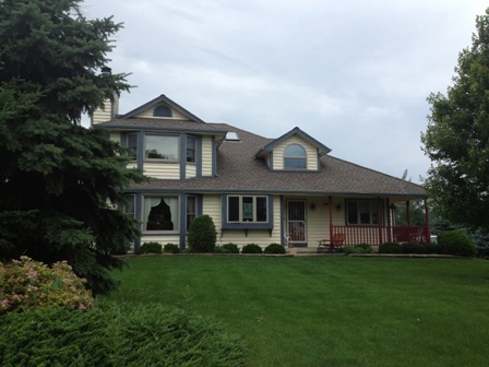 26001 Mary Road Garden Prairie, IL 61038 - Photo 1 of 19 a front view of a house with a yard and trees