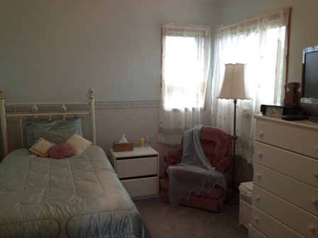 26001 Mary Road Garden Prairie, IL 61038 - Photo 12 of 19 a bedroom with a bed and a flat screen tv
