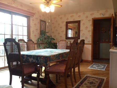 26001 Mary Road Garden Prairie, IL 61038 - Photo 8 of 19 a view of a dining room with furniture and window