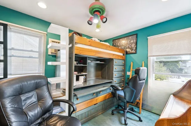 a bathroom with a granite countertop sink toilet a mirror and shower