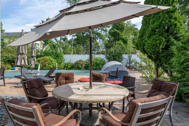 a view of a backyard with sitting area
