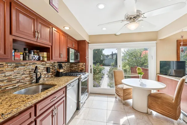 a kitchen with a stove a sink and a refrigerator