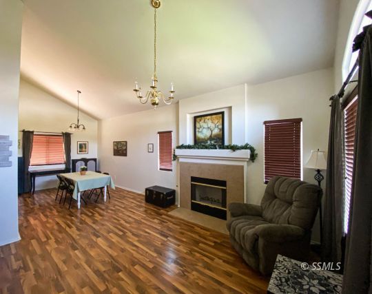 1109 Rebecca Avenue Ridgecrest, CA 93555 - Photo 11 of 50 a living room with furniture and a fireplace