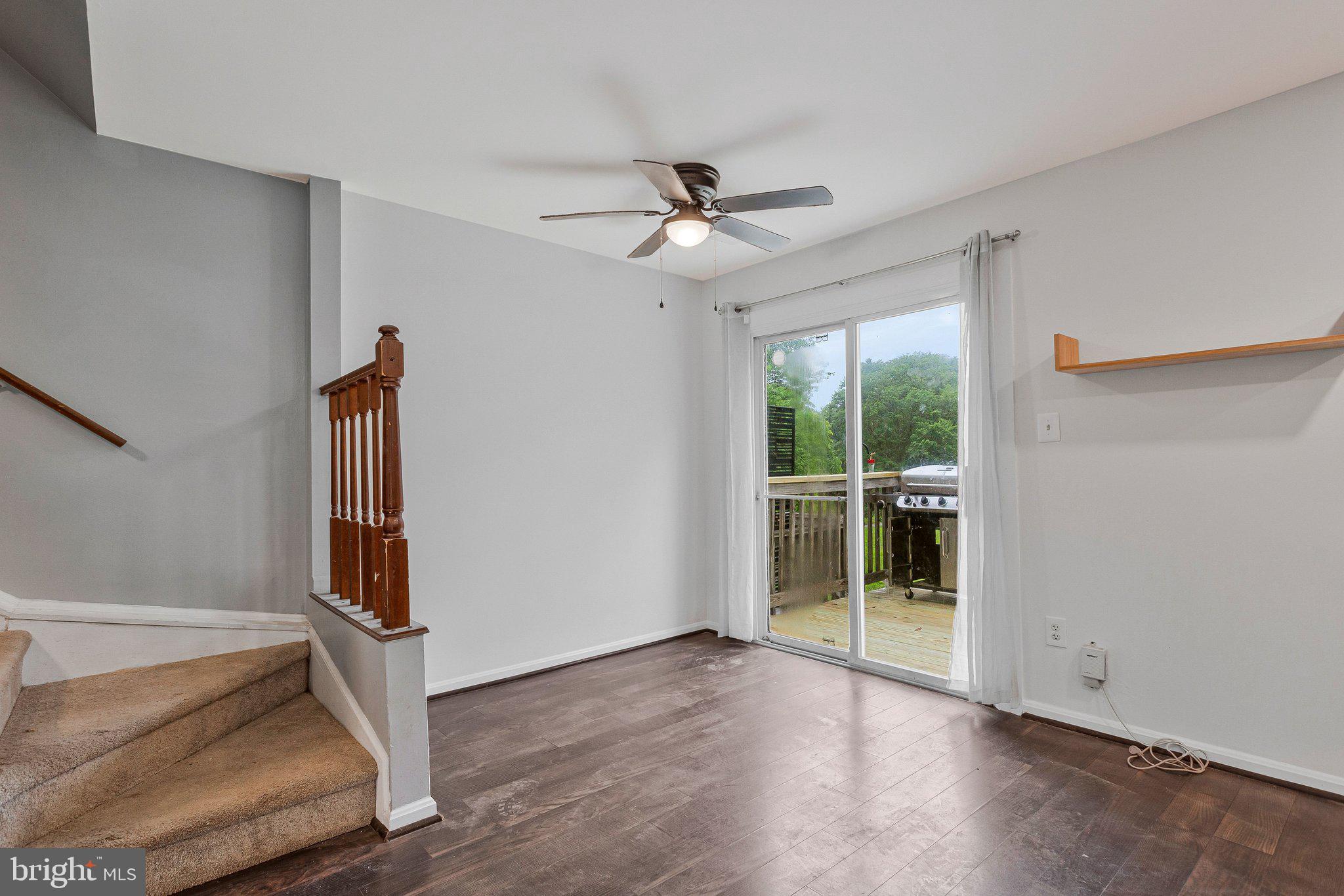 1675 Ridgely Court, Unit 182 Crofton, MD 21114 - Photo 23 of 47 an empty room with windows and ceiling fan