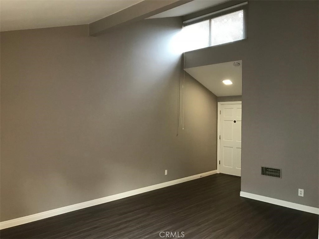 5945 Armaga Spring Road, Unit B Rancho Palos Verdes, CA 90275 - Photo 4 of 11 an empty room with wooden floor and windows
