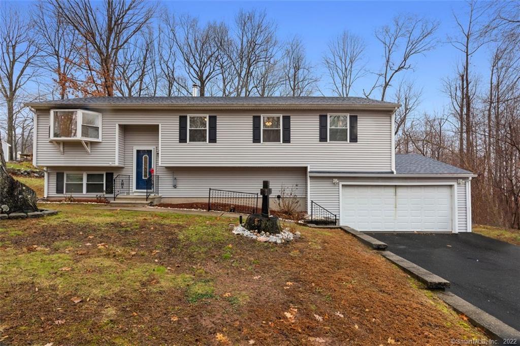 Amazing raised ranch located in a quiet area of the West Woods section of Hamden