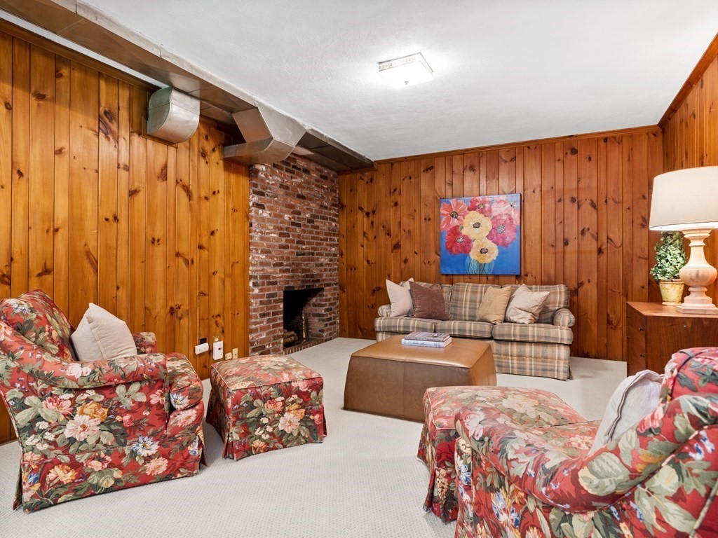 62 Arnold Road Wellesley, MA 02481 - Photo 15 of 24 a bedroom with furniture and a painting on the wall