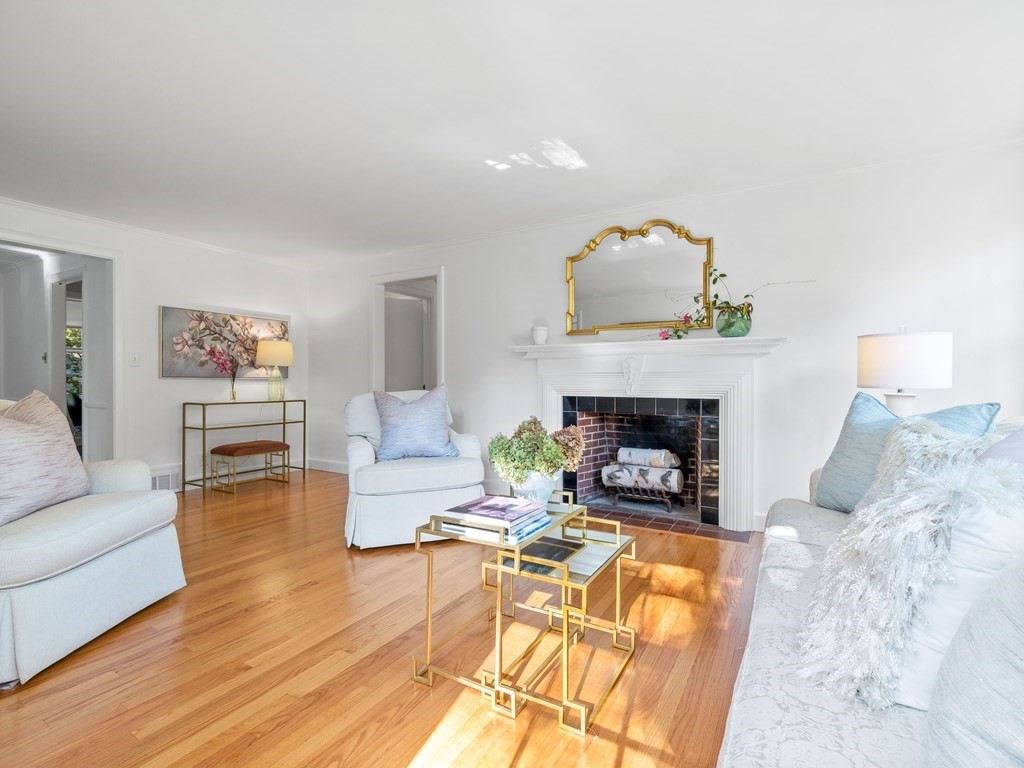 62 Arnold Road Wellesley, MA 02481 - Photo 3 of 24 a living room with furniture and a fireplace