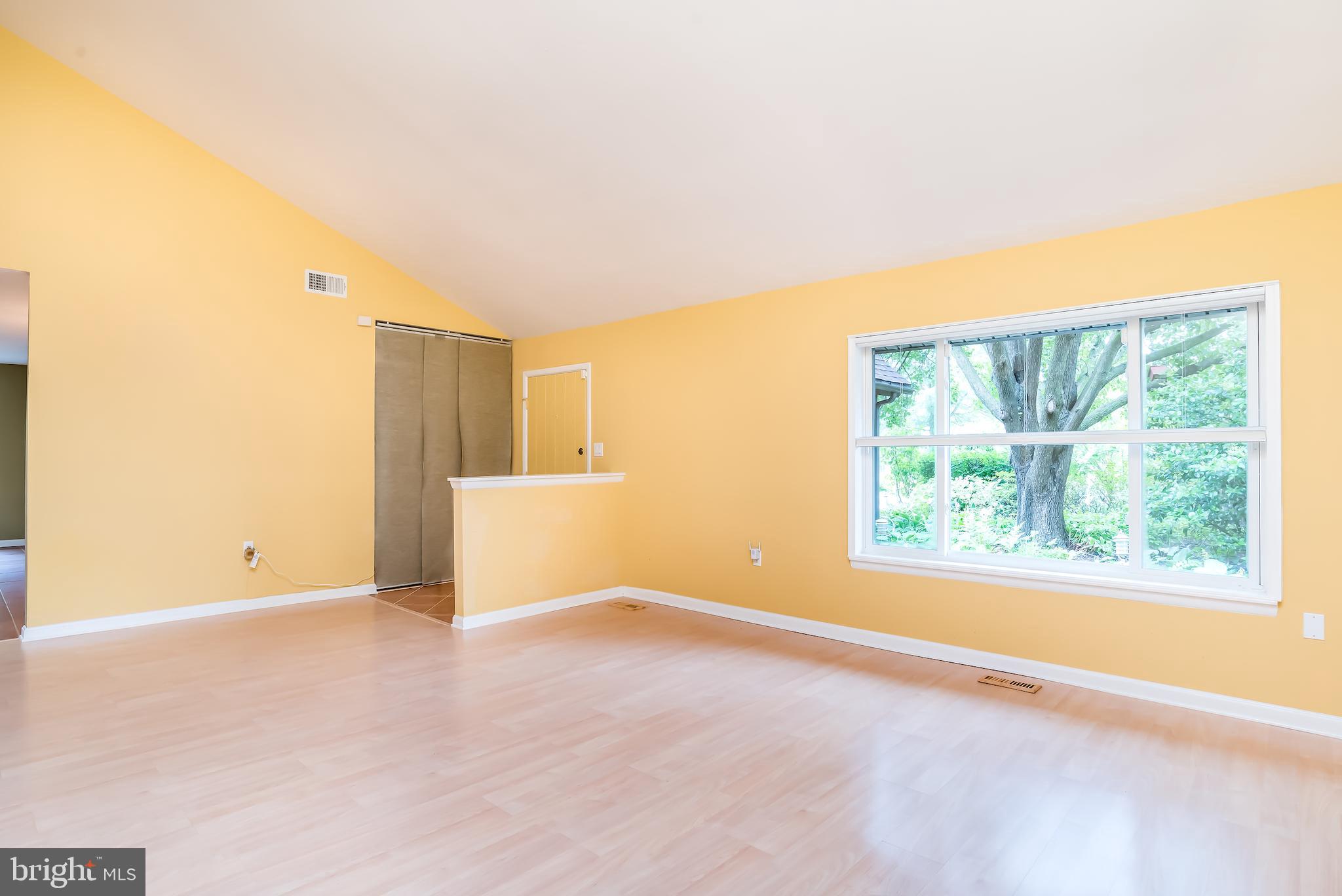 5941 Hall Street Springfield, VA 22152 - Photo 4 of 35 Living room boasts vaulted ceiling and wood floor