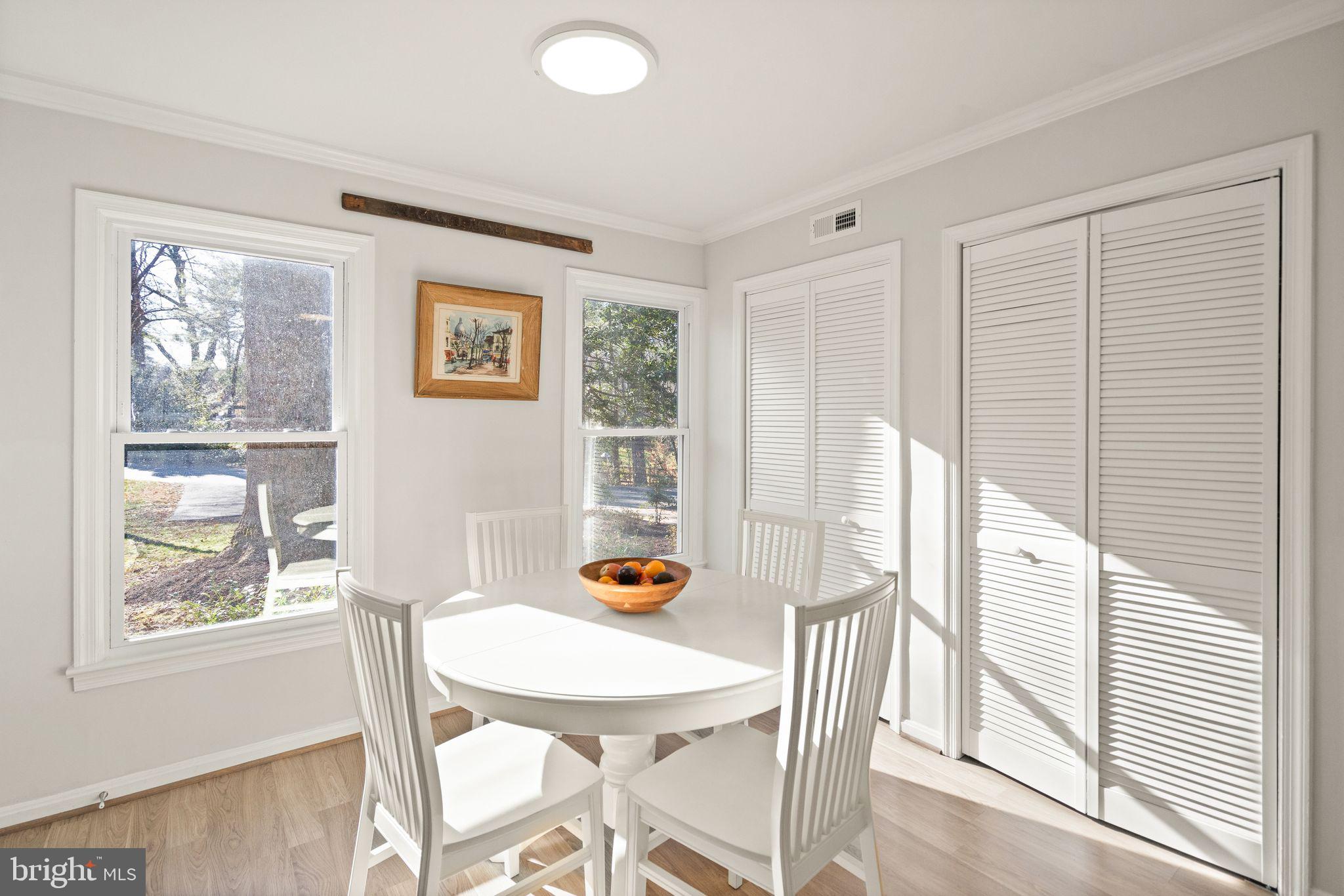 10808 Hunt Club Road Reston, VA 20190 - Photo 14 of 49 a view of a dining room with furniture and a window