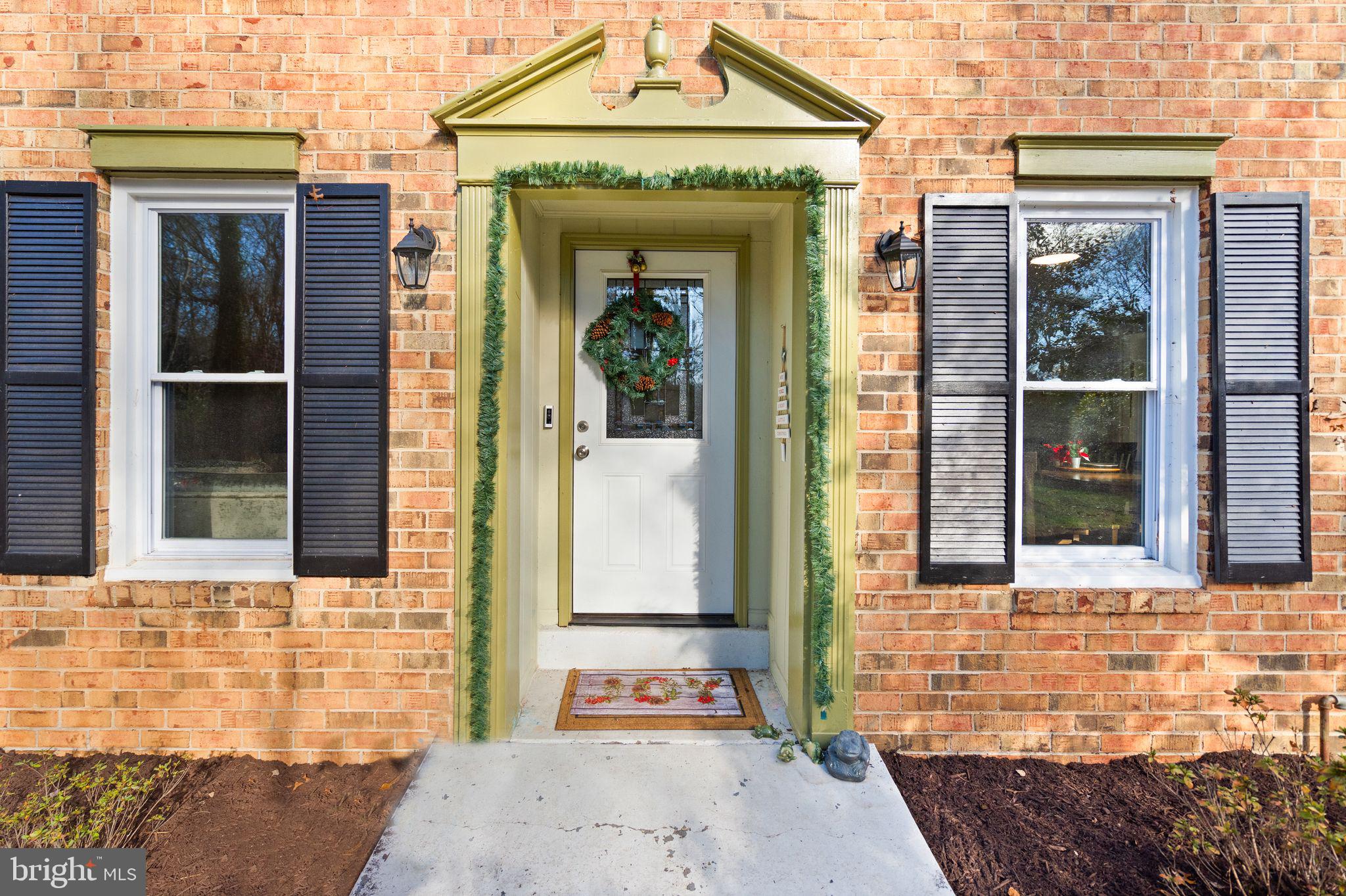 10808 Hunt Club Road Reston, VA 20190 - Photo 4 of 49 a front view of a house with a shower