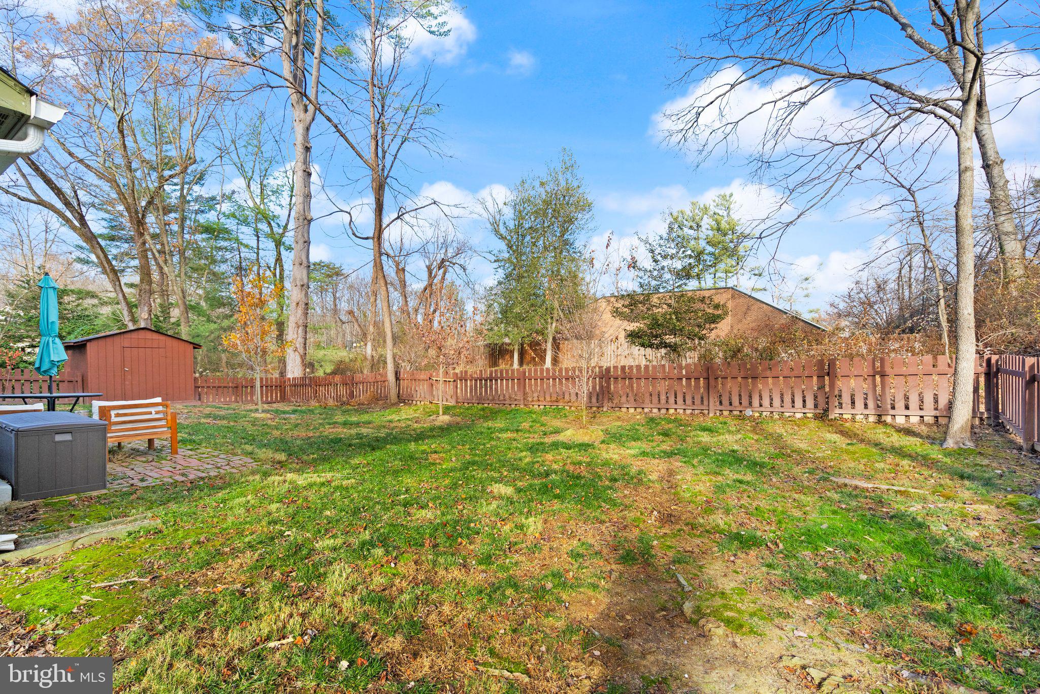 10808 Hunt Club Road Reston, VA 20190 - Photo 47 of 49 a view of a backyard with a garden and trees