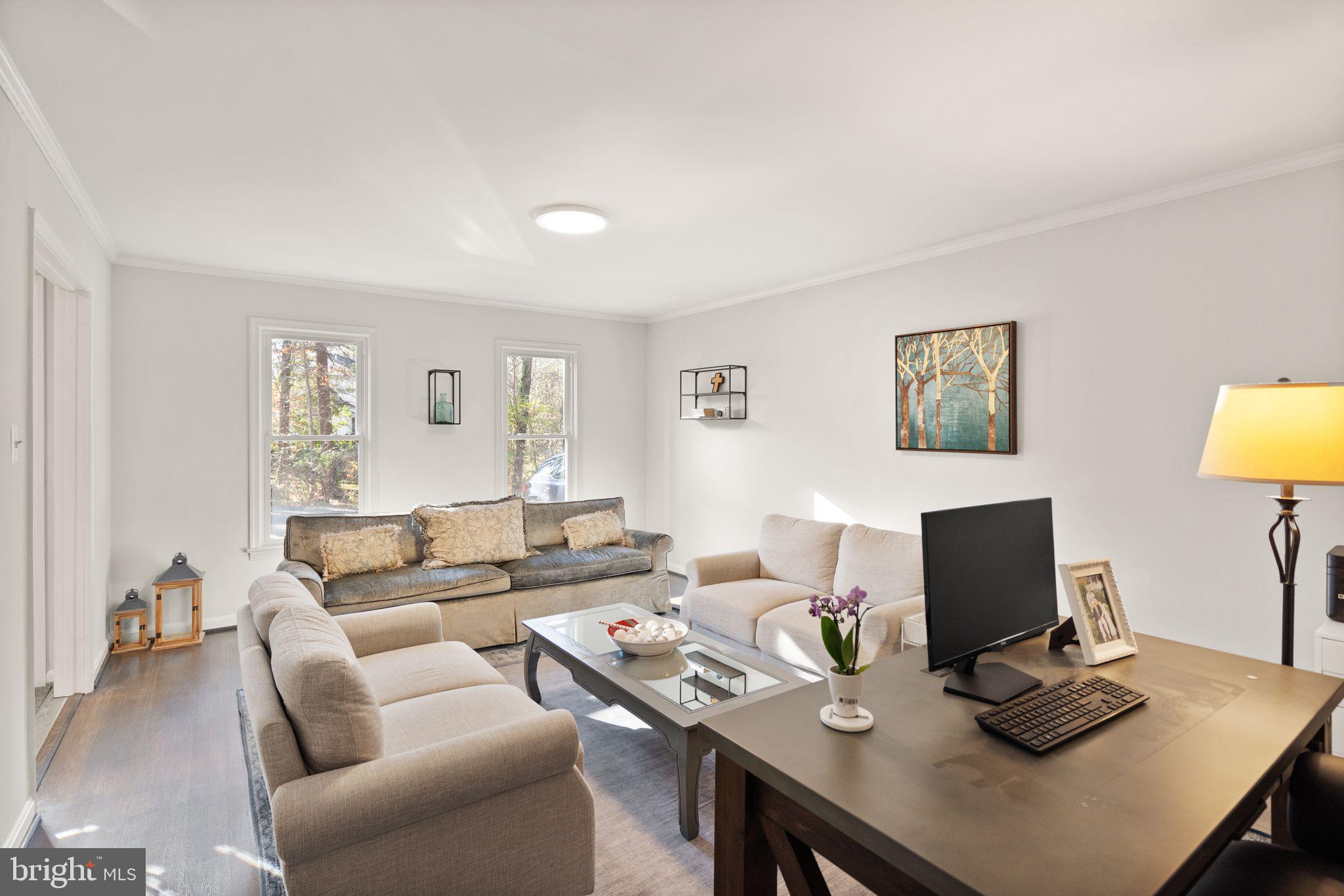 10808 Hunt Club Road Reston, VA 20190 - Photo 8 of 49 a living room with furniture and a flat screen tv