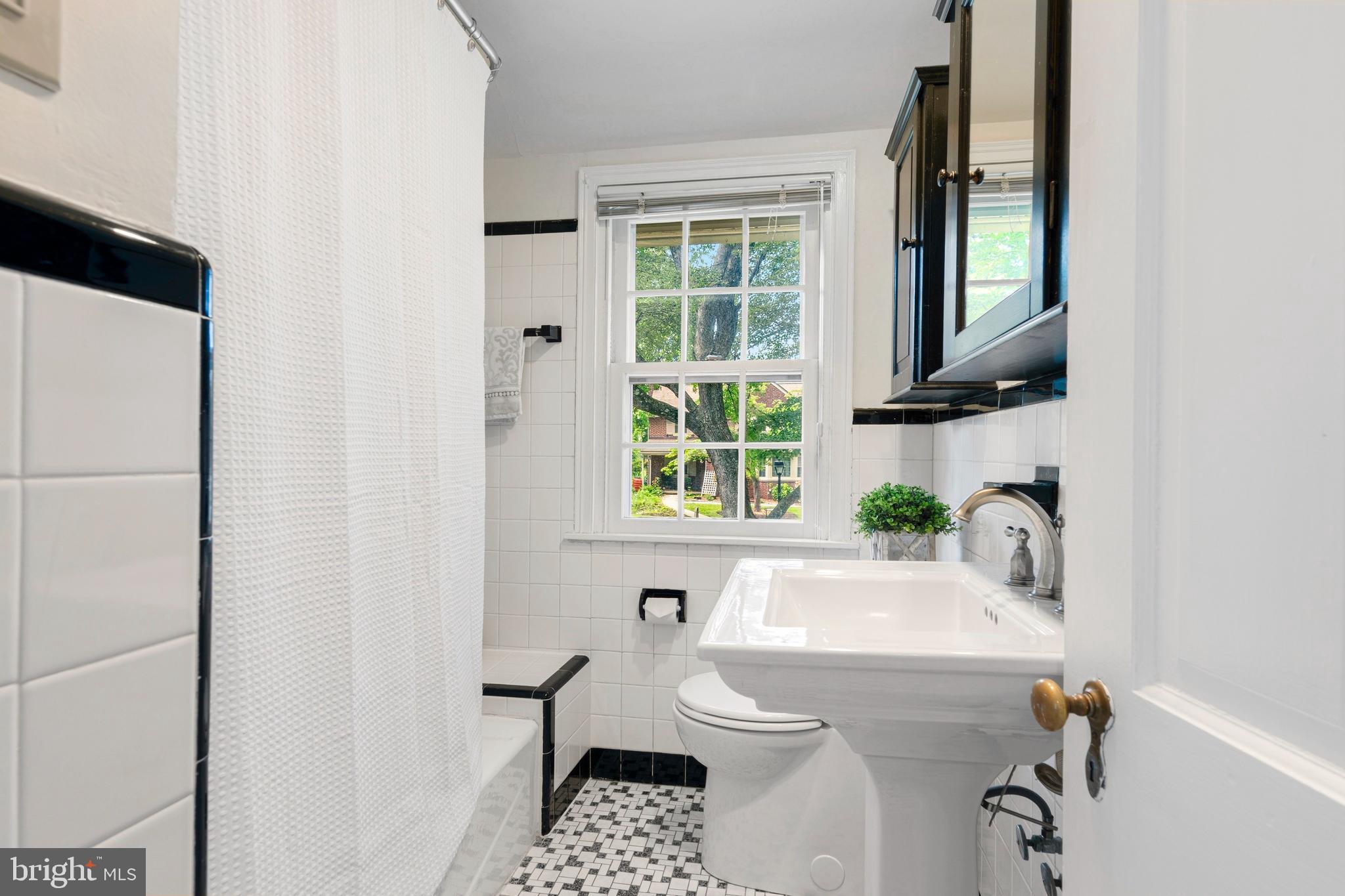 5020 Dermond Road Drexel Hill, PA 19026 - Photo 24 of 39 a bathroom with a sink a toilet and a window