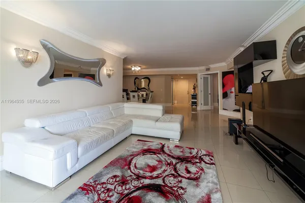 a view of a livingroom with furniture and a flat screen tv