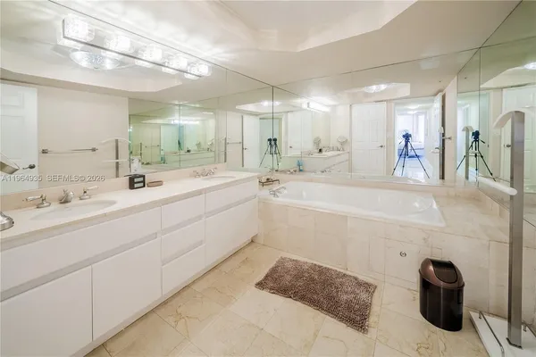 a bathroom with a double vanity sink and a mirror