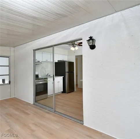 a view of a kitchen with a refrigerator