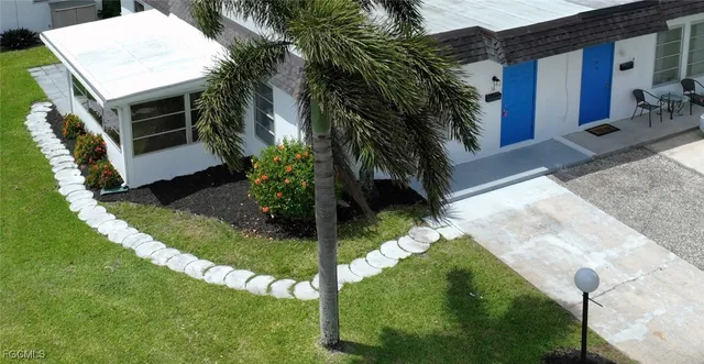 a view of backyard with swimming pool and outdoor
