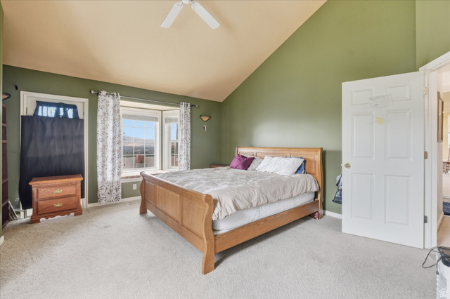 2887 View Crest Circle North Logan, UT 84341 - Photo 24 of 37 Bedroom with carpet flooring, lofted ceiling, and ceiling fan