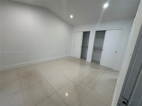 an empty room with a bathroom