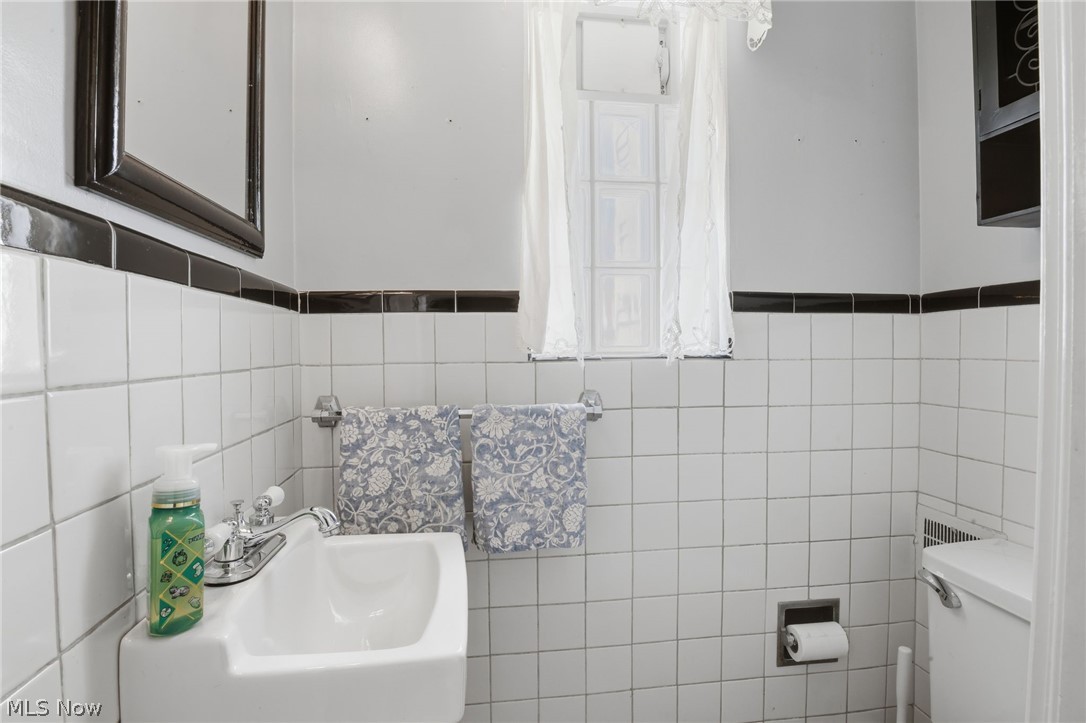 1390 Brainard Road Lyndhurst, OH 44124 - Photo 16 of 33 Half bathroom with tile walls