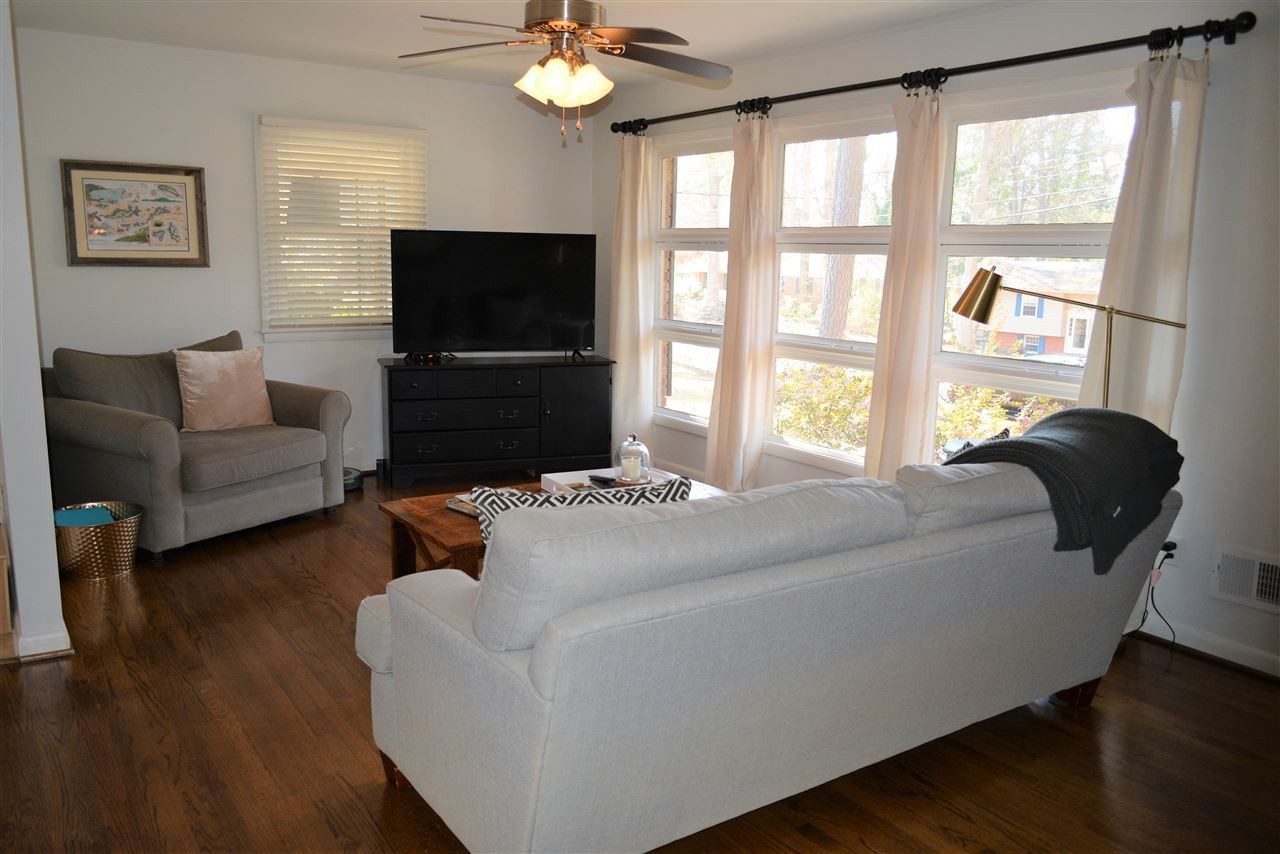 204 Winterlochen Road Raleigh, NC 27603 - Photo 3 of 28 Gorgeous hardwood floors, smooth ceilings, open to kitchen & dining-perfect to relax with family & friends Open & spacious living & dining