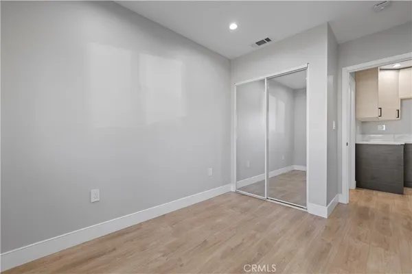 a bedroom with a bed and a lamp