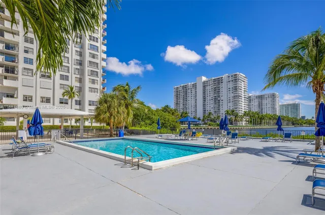 a living room with lots of furniture and a fountain