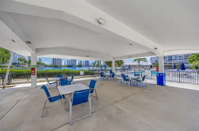 a view of a livingroom with furniture a flat screen tv