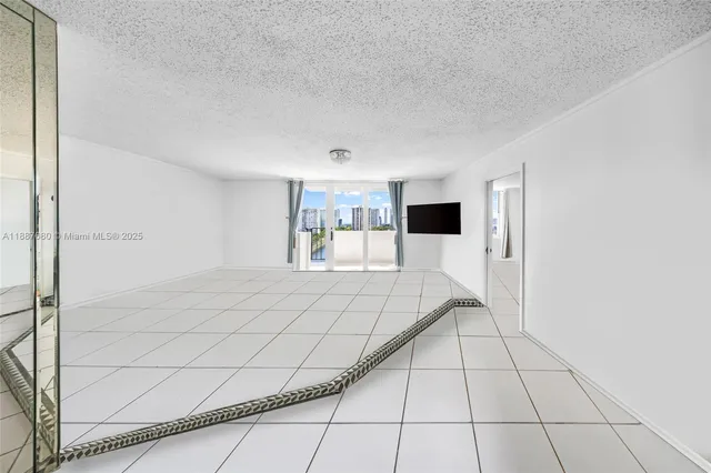 a view of an empty room and entryway