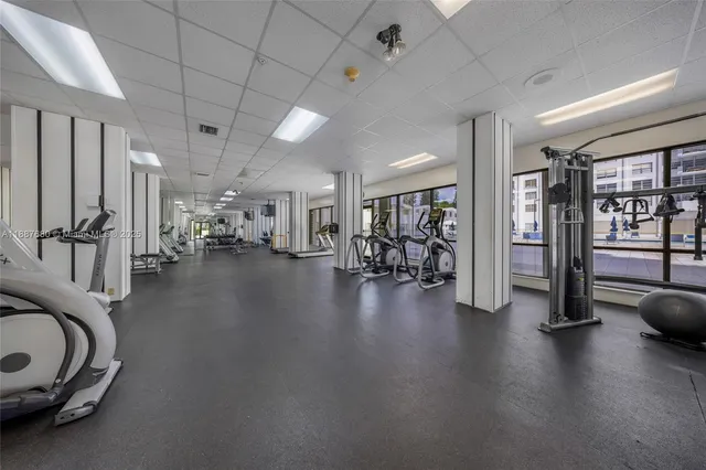 a view of a swimming pool with outdoor seating and plants