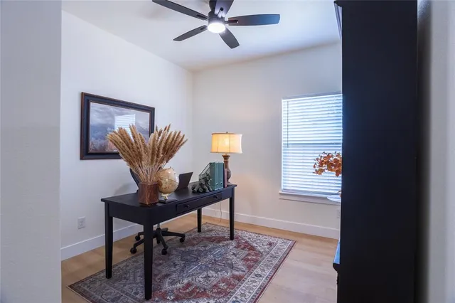 a workspace with furniture and a window