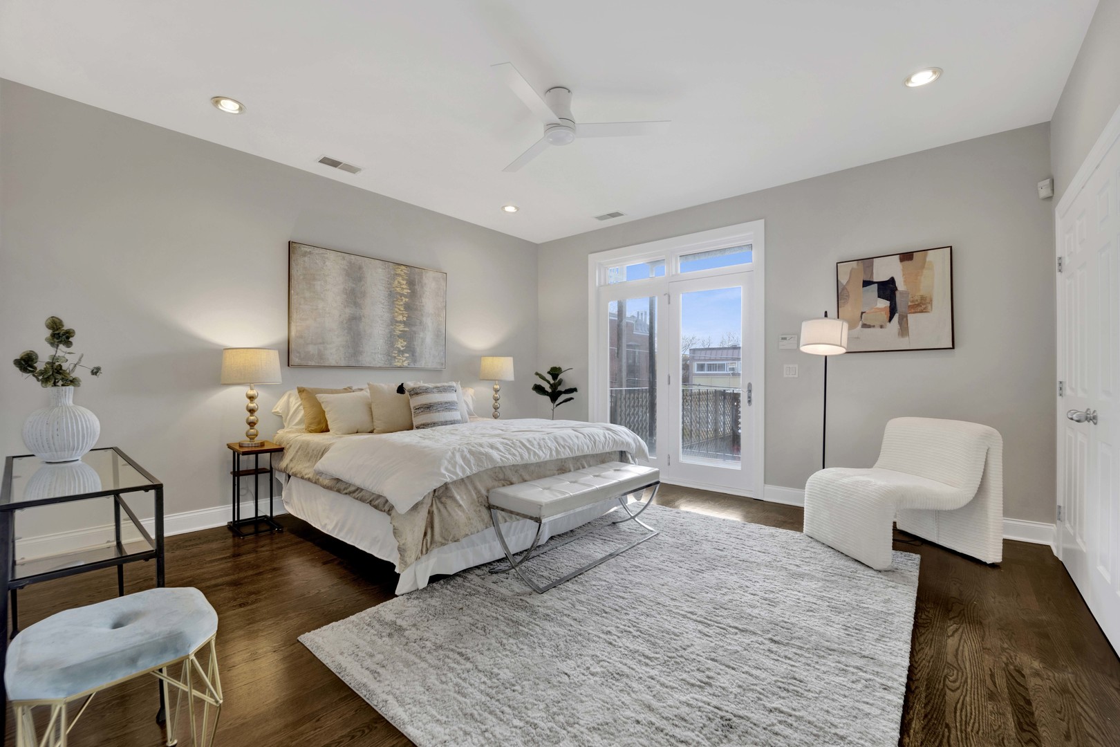 1724 North Mohawk Street, Unit 2 Chicago, IL 60614 - Photo 12 of 24 a spacious bedroom with a bed a couch and a potted plant