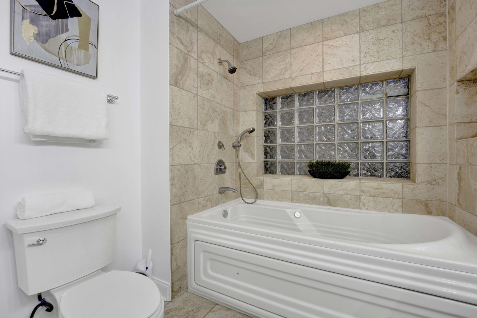 1724 North Mohawk Street, Unit 2 Chicago, IL 60614 - Photo 15 of 24 a bathroom with a sink a toilet and shower