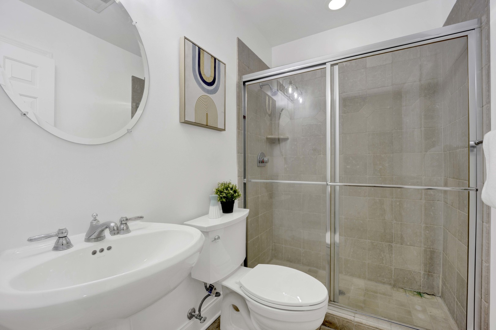 1724 North Mohawk Street, Unit 2 Chicago, IL 60614 - Photo 16 of 24 a bathroom with a bathtub shower sink mirror and toilet