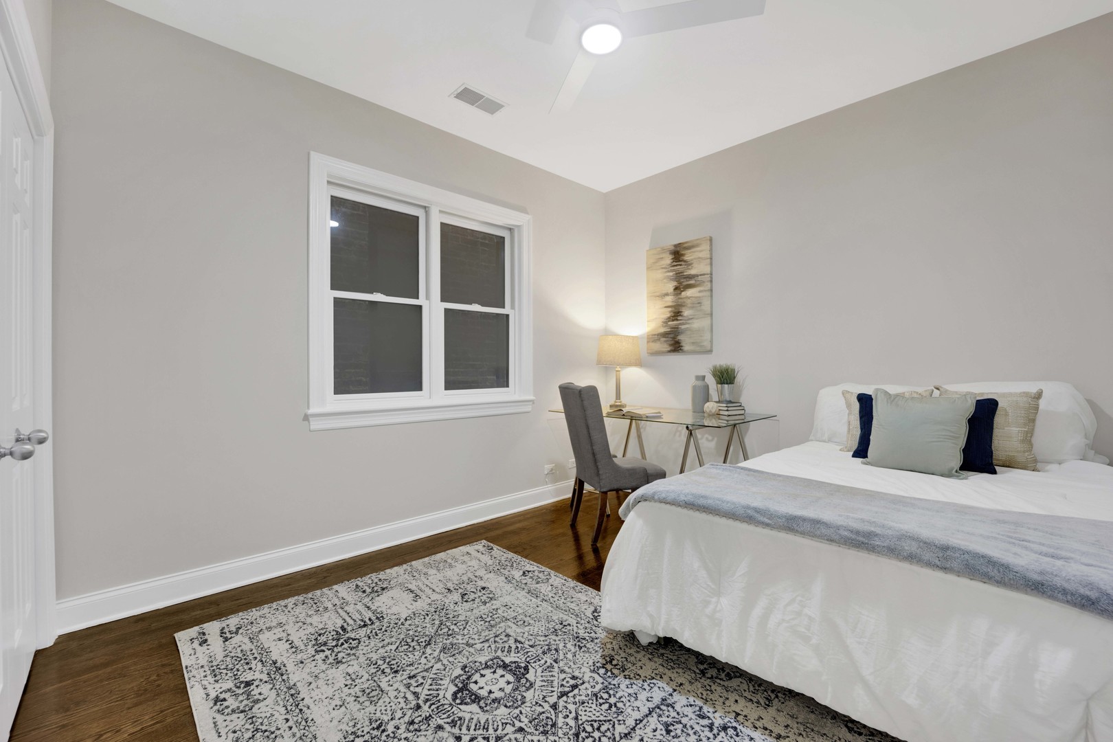 1724 North Mohawk Street, Unit 2 Chicago, IL 60614 - Photo 17 of 24 a bedroom with a bed and a window