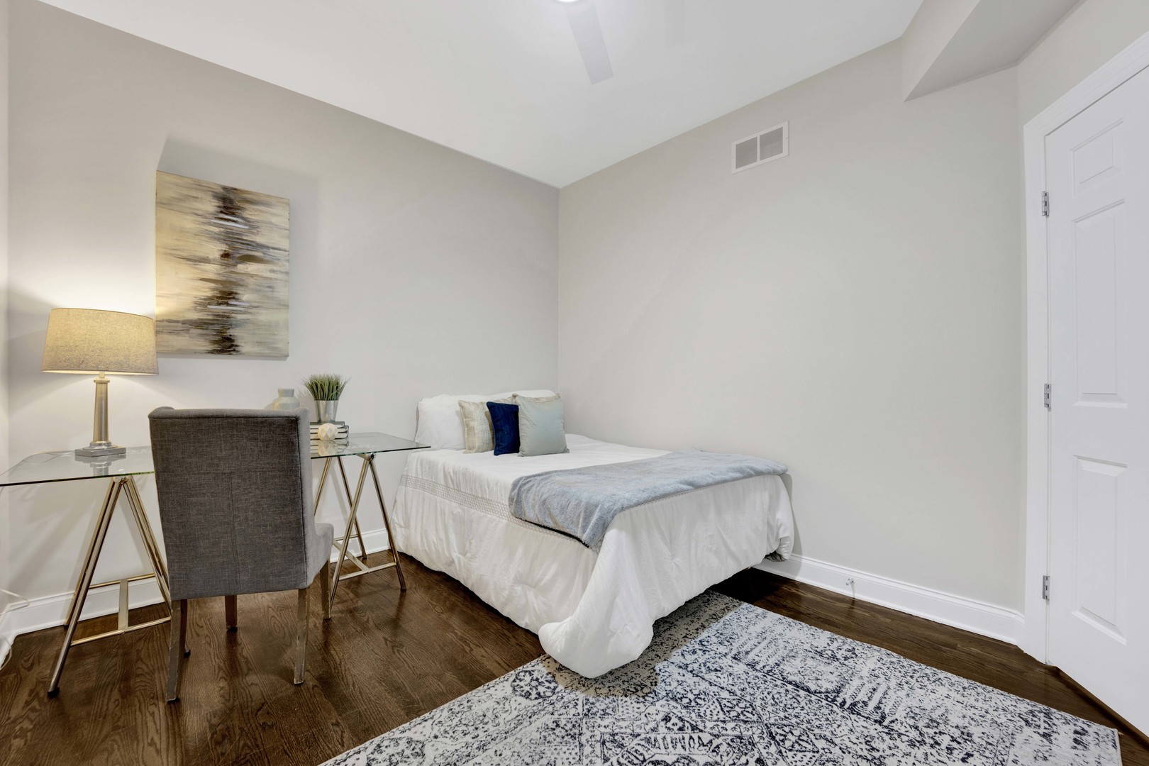 1724 North Mohawk Street, Unit 2 Chicago, IL 60614 - Photo 18 of 24 a bedroom with a bed and a table in it