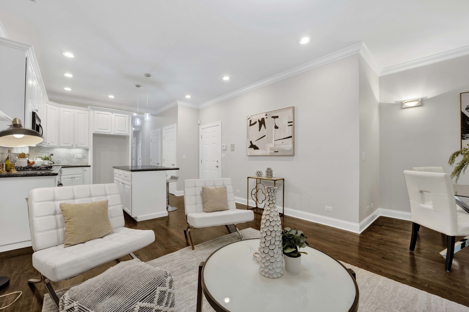 1724 North Mohawk Street, Unit 2 Chicago, IL 60614 - Photo 2 of 24 a living room with furniture and a dining table with wooden floor