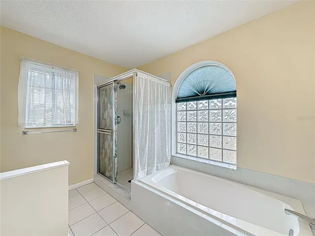 a bathroom with a bathtub and a shower