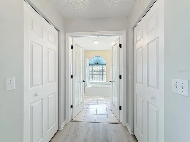a view of an entryway with wooden floor