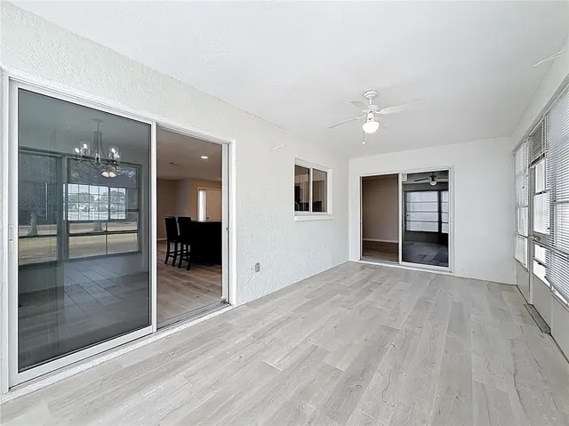 a view of livingroom with hardwood floor and a ceiling fan