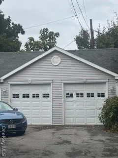 a view of a car park in front of house