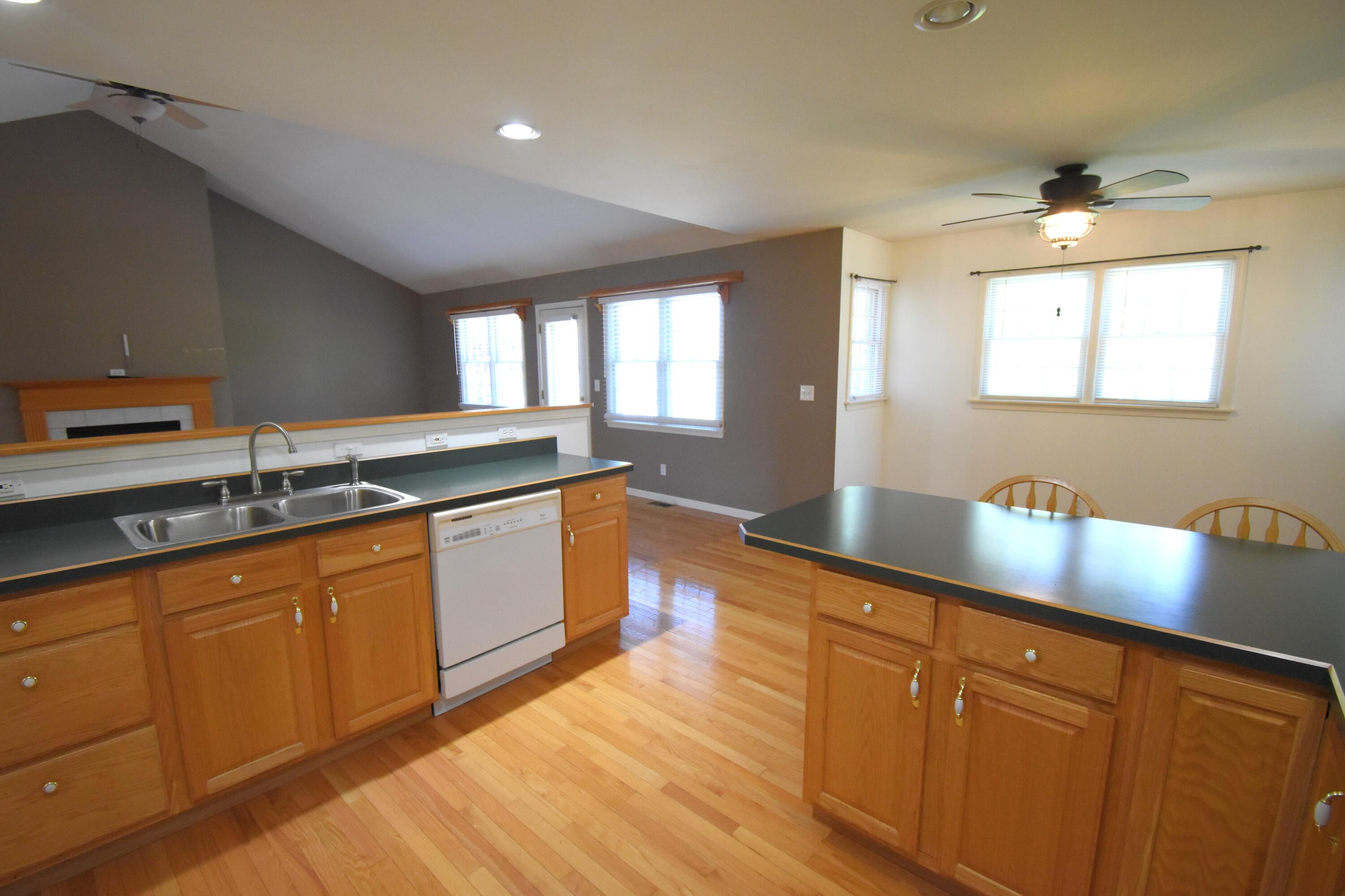 522 Pheasant Run Rensselaer, IN 47978 - Photo 31 of 55 a large kitchen with granite countertop a sink counter space and cabinets
